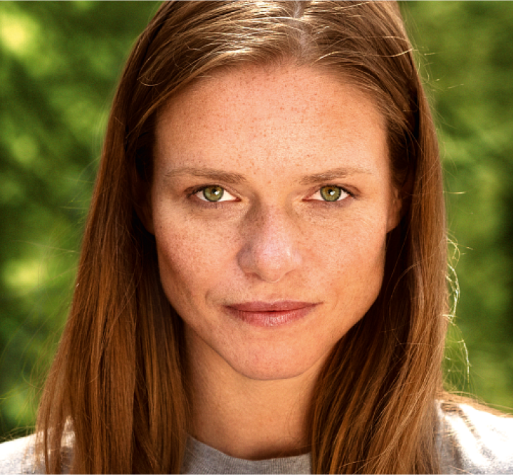 woman with green eyes looking straight at you