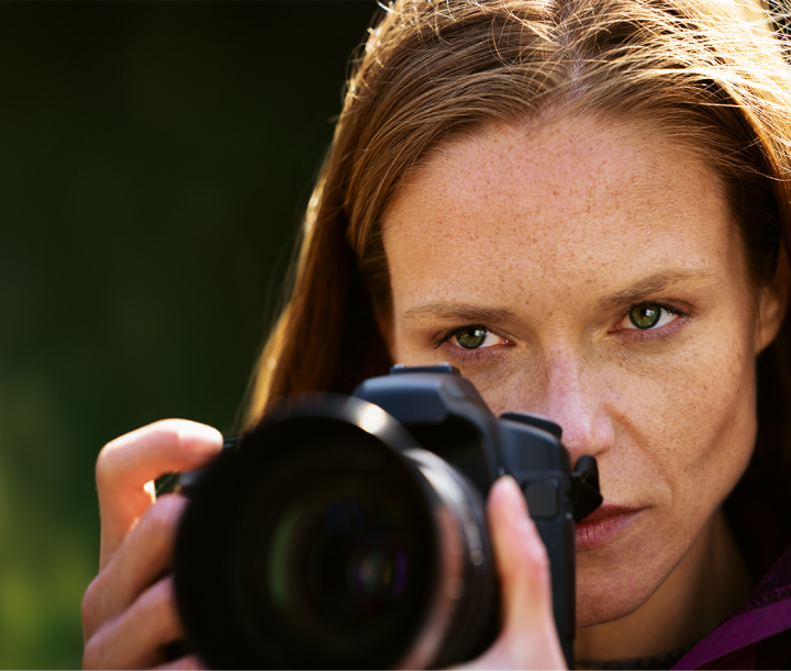 close up of a woman taking a photo