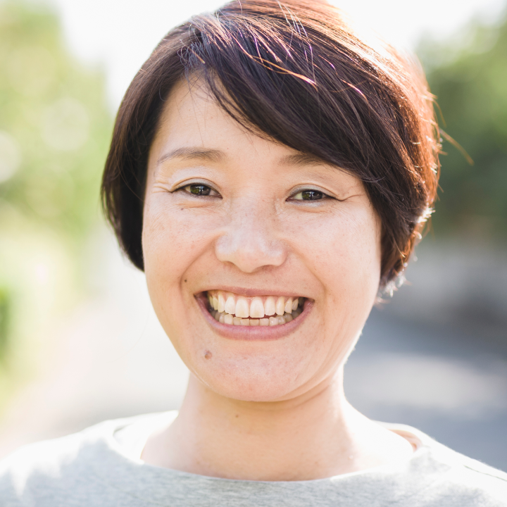 woman with short brown hair smiling