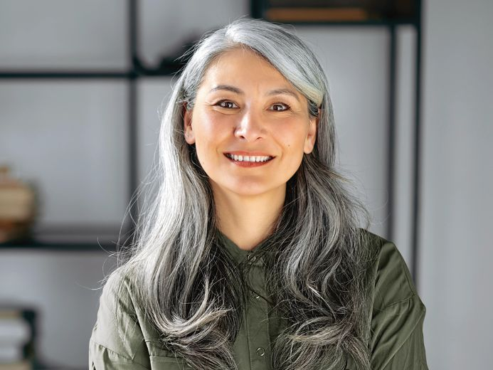 Smiling elderly woman with gray hair
