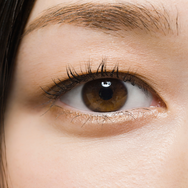 Close up of a brown colored eye looking up