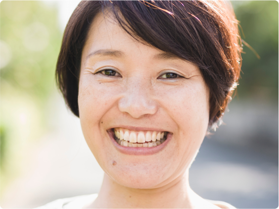A woman smiling.