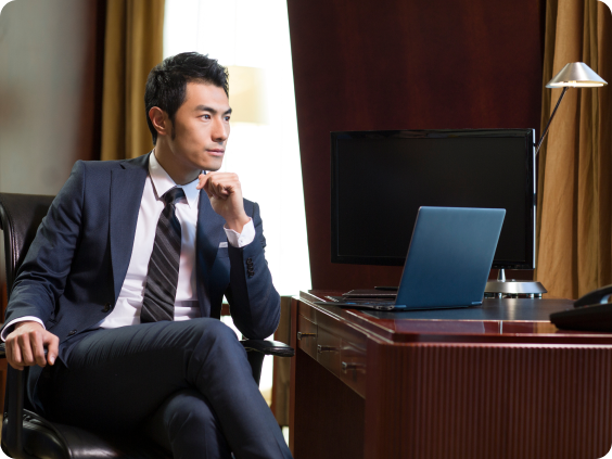 Man in suit at laptop