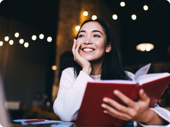 Smiling woman with a book