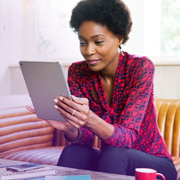 Woman registers for Systane offers on tablet